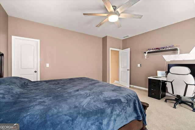 bedroom featuring ceiling fan and light carpet