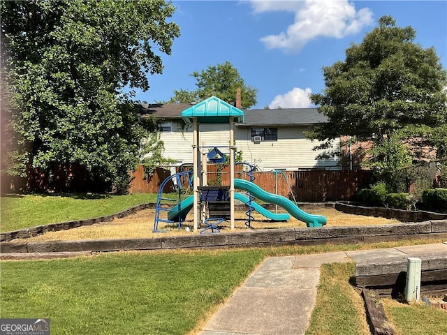 view of jungle gym with a lawn