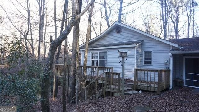 view of front of property featuring a wooden deck