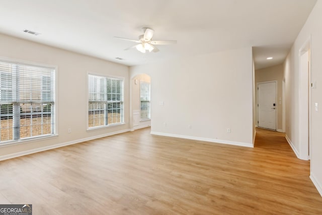 empty room with light wood-type flooring and ceiling fan