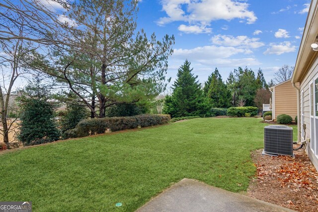 view of yard featuring central AC