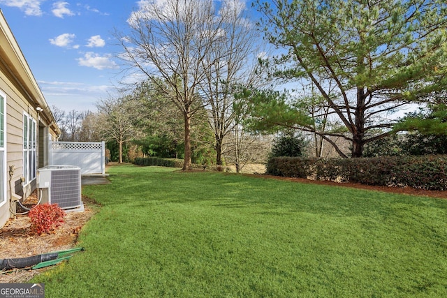 view of yard with central AC unit