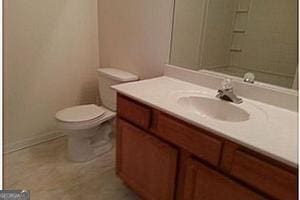 bathroom with vanity and toilet