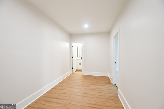 corridor with light wood-type flooring