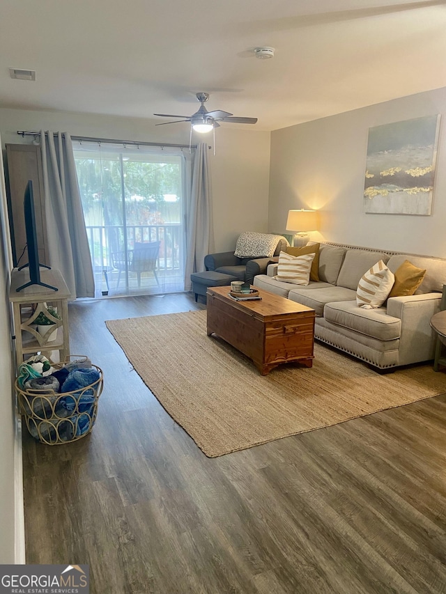 living room with hardwood / wood-style flooring and ceiling fan