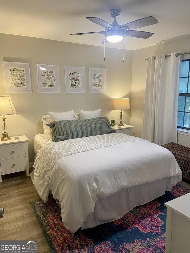 bedroom featuring light hardwood / wood-style flooring and ceiling fan