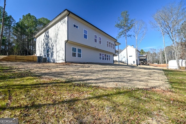 rear view of property with a yard