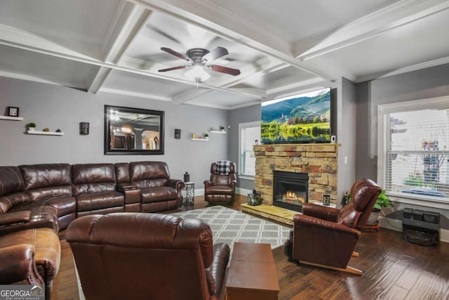 living room featuring coffered ceiling, crown molding, ceiling fan, a fireplace, and beam ceiling