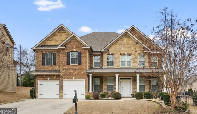 view of front of house featuring driveway, a shingled roof, an attached garage, a porch, and brick siding