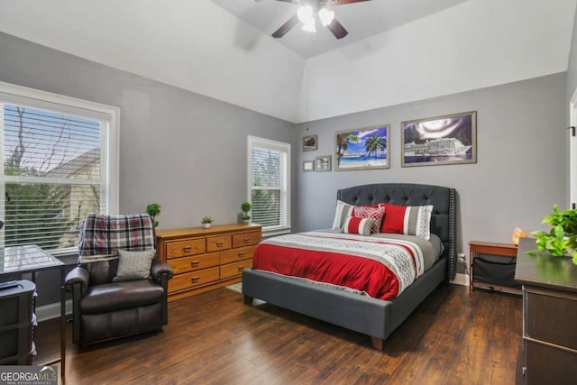 bedroom with dark hardwood / wood-style floors, vaulted ceiling, and ceiling fan