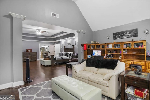 living room featuring ceiling fan and dark wood-type flooring