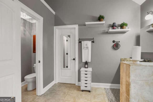 bathroom with tile patterned floors and toilet