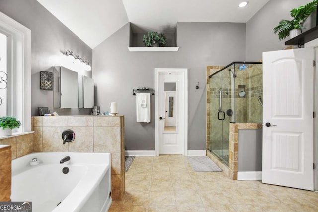 bathroom with lofted ceiling, tile patterned floors, and independent shower and bath