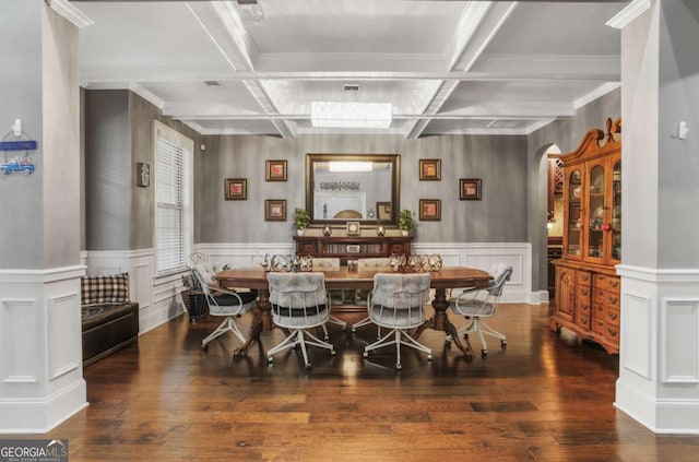 dining room with beamed ceiling, ornamental molding, and coffered ceiling