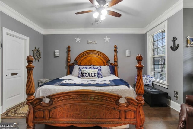 bedroom featuring ceiling fan, crown molding, and dark hardwood / wood-style floors