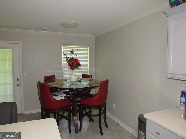 dining area featuring ornamental molding