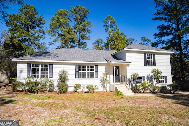 split level home with a front yard