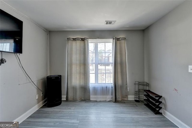 spare room featuring hardwood / wood-style flooring