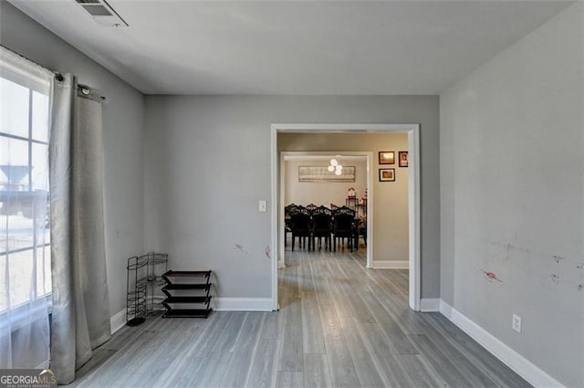 corridor featuring wood-type flooring