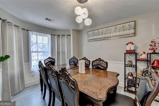 dining area with wood-type flooring