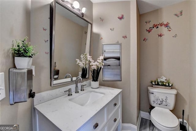 bathroom with vanity and toilet