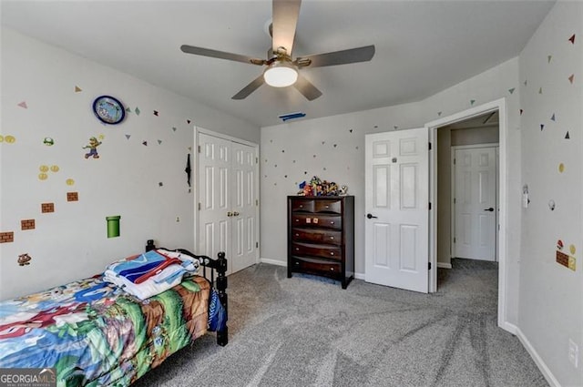 bedroom with carpet floors, a closet, and ceiling fan