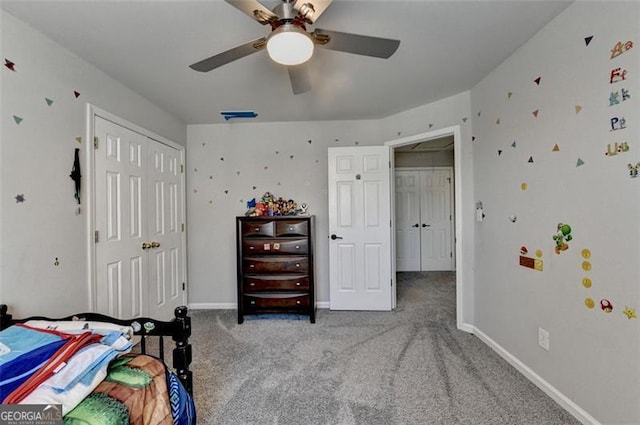 bedroom featuring ceiling fan, a closet, and light carpet