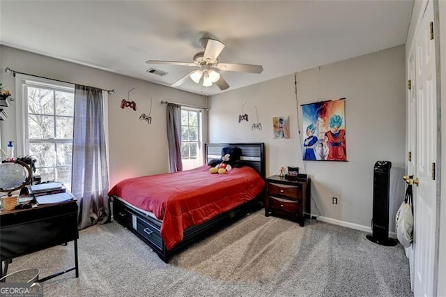 carpeted bedroom with ceiling fan