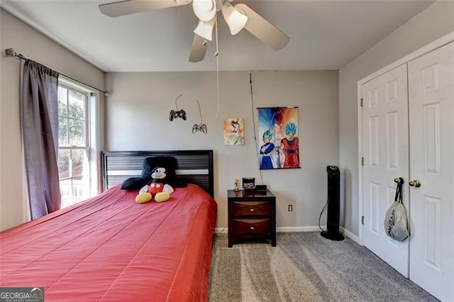 bedroom featuring ceiling fan, a closet, and carpet