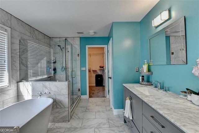 bathroom with plus walk in shower and vanity