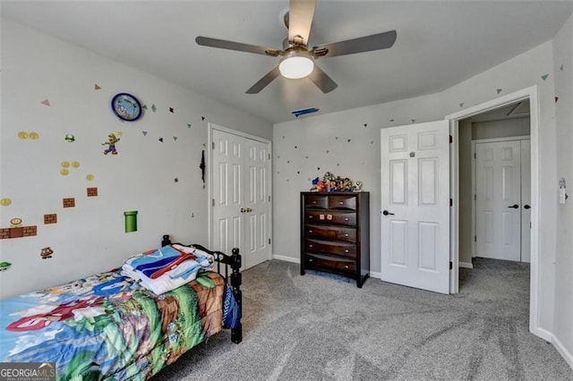 carpeted bedroom with a closet and ceiling fan