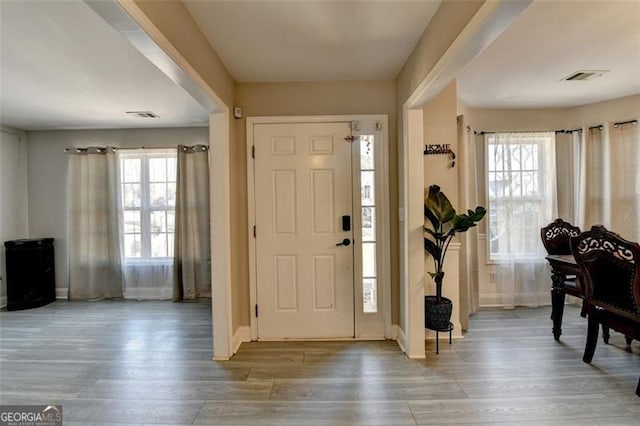 foyer entrance with hardwood / wood-style floors