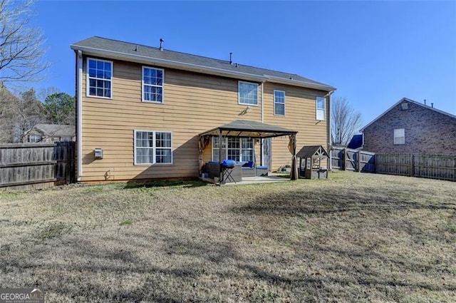 back of house with a gazebo and a patio