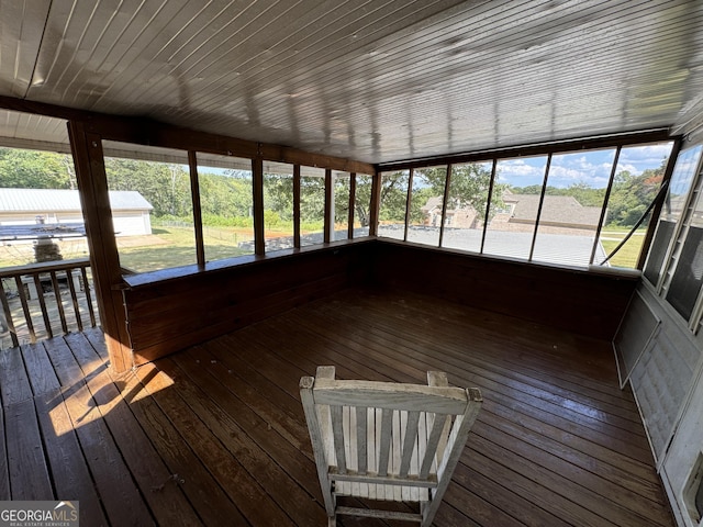 unfurnished sunroom featuring a wealth of natural light