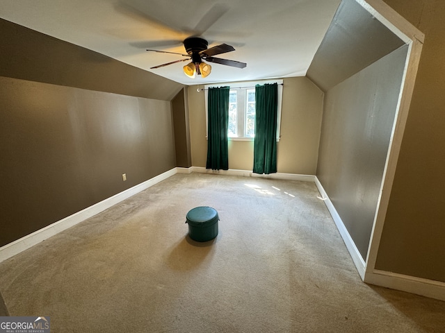 additional living space with carpet, ceiling fan, and lofted ceiling