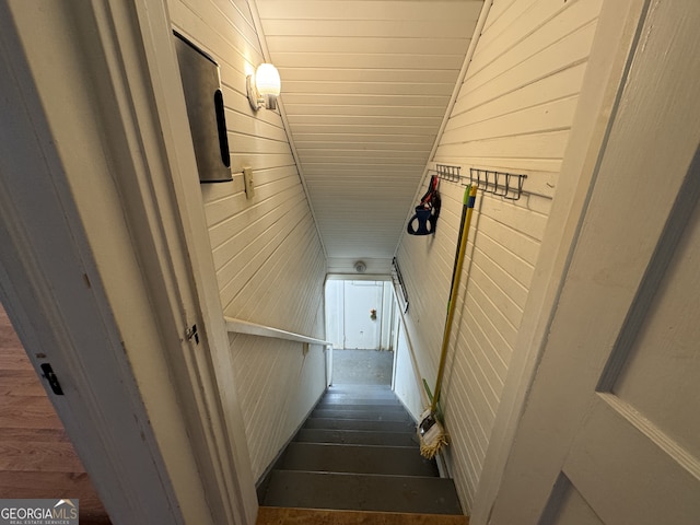 stairway with wooden walls