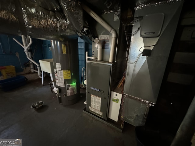 utilities featuring gas water heater and sink