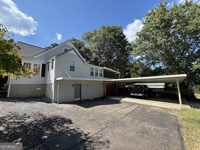 view of property exterior with a carport