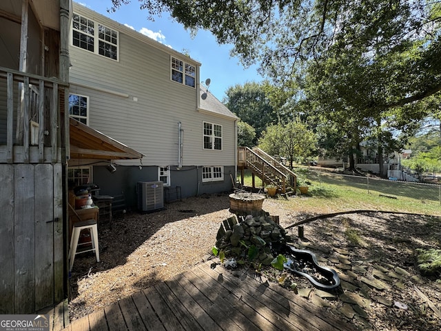 rear view of property featuring central air condition unit