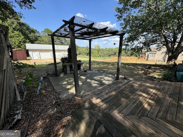 wooden deck with a pergola and a storage unit