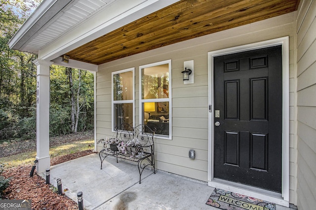 doorway to property featuring a porch