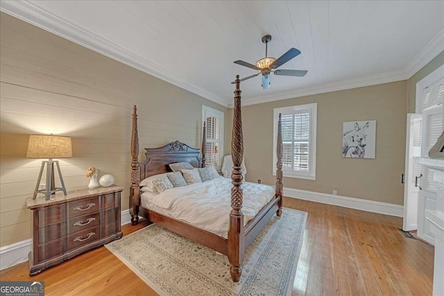 bedroom with ceiling fan, crown molding, and light wood-type flooring