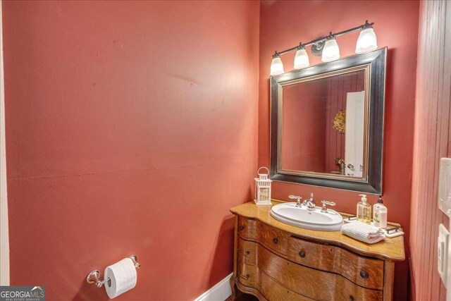 half bathroom with vanity