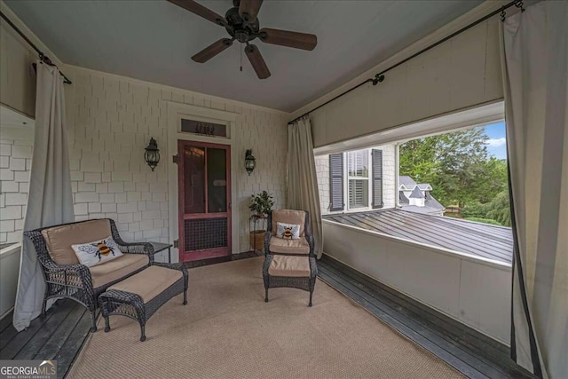 exterior space with a porch and ceiling fan