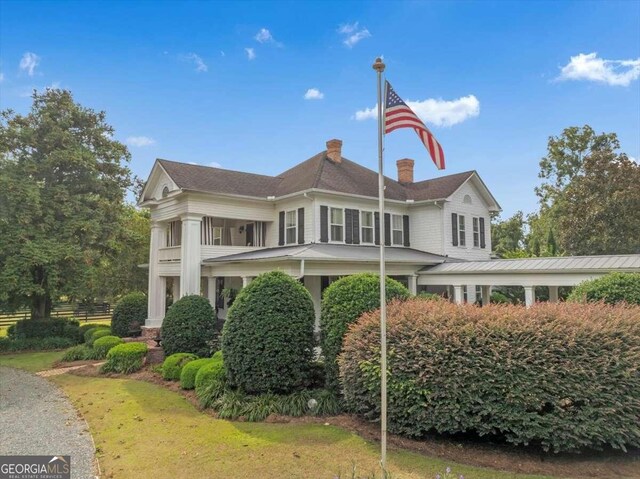 view of front of home featuring a chimney