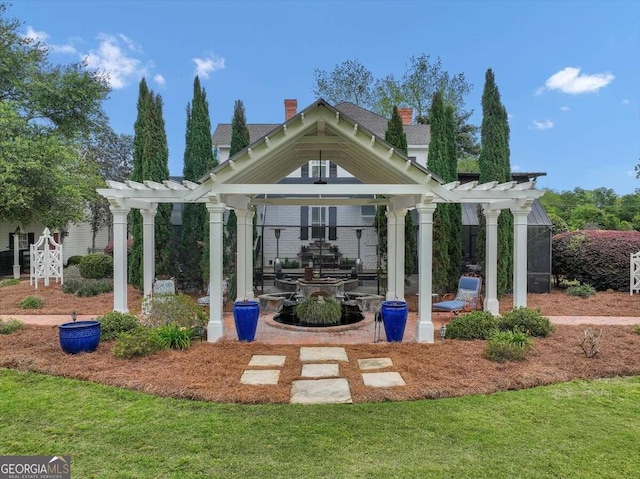 view of property's community with a pergola and a yard