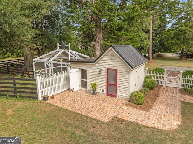 view of outdoor structure with a lawn