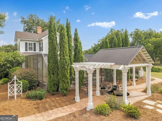 view of home's community with a pergola