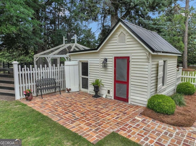 view of outbuilding with fence