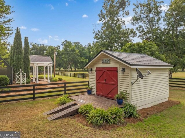 view of shed with fence
